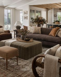 a living room filled with lots of furniture