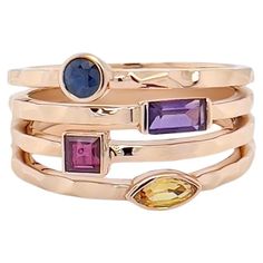 This stunning and luxurious ring has the illusion of a stacking ring. Made out of the finest 18k rose gold and accentuated with mix color and various shaped colored gems. The carefully selected vibrant colored stones can be customized to your preference. The layers on the ring are created from pounded rose gold giving an organic and playfulness perfect for casual or special occasions. This ring will add a touch of glamour and sophistication to any look. Luxury Multicolor Ruby Ring Gift, Fine Jewelry Multi-stone Sapphire Ring In Rose Gold, Rose Gold Multi-stone Sapphire Ring, Elegant Multicolor Stackable Rings, Luxury Multi-stone Rose Gold Sapphire Ring, Luxury Rose Gold Multi-stone Sapphire Ring, Luxury Multi-stone Sapphire Ring In Rose Gold, Fine Jewelry Multi-stone Stackable Rings, Elegant Multicolor Rings With Bezel Setting