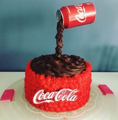 a coca cola cake with chocolate frosting on top