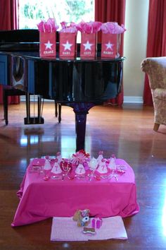 the table is set up with pink bags