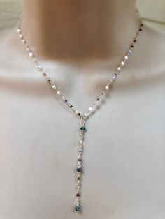 "This is one of my favorite chains to use, so fluid and shimmery. This cool tone sterling silver picks up all the colors in the rainbow. I placed faceted moonstones and blue topaz stones intermittently with bezel pendants on two of the strands. Each strand is separate with its own clasp and extension chain. Each necklace is sold separately or you can purchase all three as a set at a lower price. The top necklace with the Blue Topaz bezel pendant measures 15\" inches and comes with an additional Silver Lariat Necklace With Natural Stones, Blue Sterling Silver Lariat Jewelry, Blue Sterling Silver Lariat Necklace Gift, Dainty Silver Necklace With Natural Stones, Silver Adjustable Teardrop Crystal Necklace, Silver Adjustable Teardrop Crystal Necklaces, Silver Wire Wrapped Lariat Necklaces, Iridescent Sterling Silver Spiritual Jewelry, Silver Bohemian Lariat Necklace With Natural Stones