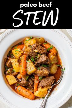 beef stew with potatoes and carrots in a white bowl on top of a table