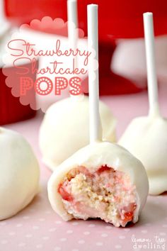 strawberry cake pops are sitting on a table