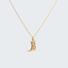 "Introducing our unisex stunning cowboy boot necklace. This 14k yellow gold necklace features an engraved five stars on a cowboy boot that has a bright polished finish. An adjustable 16\" to 18 inches loose rope chain delicately complements the unique design. The perfect addition to any western-themed jewelry collection. It features a beautifully crafted cowboy boot pendant, making it the ideal cowgirl or cowboy necklace for any occasion. Made with the highest quality materials, ensuring that it will last for years to come. Whether you're looking for a themed charm necklace or simply a piece of unique western jewelry, our cowboy boot pendant is sure to impress. Shop now and add this one-of-a-kind piece to your collection. 100% Handmade in Boca Raton, FL Each necklace is made to order.  Mad Western Style Engraved Gold Jewelry, Engraved Gold Western Jewelry, Western Gold Engraved Jewelry, Cowboy Necklace, Cowboy Boot Necklace, Mini Cowboy, Pendant Making, 14k Yellow Gold Necklace, Western Jewelry