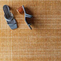 a pair of shoes sitting on top of a rug