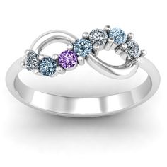 three stone ring with the word love written in blue, purple and white stones on it