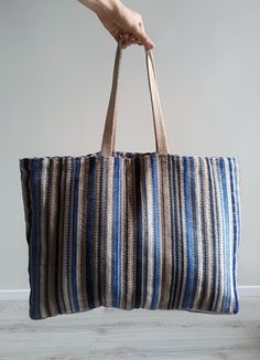 Meet Martinz Studio's versatile Big Beach Bag – the ultimate blend of style and function for any adventure! With durable leather straps and a spacious design, it's perfect for beach days, shopping trips, travel, gym sessions, or casual strolls. A convenient pocket secures your valuables, while the roomy interior holds all your essentials with ease. Made from stunning striped blue and beige textured fabric, this boho tote adds a touch of elegance to your everyday style. Its unique fabric pattern and exceptional craftsmanship make it a true head-turner wherever you go. Striped Rectangular Shoulder Bag For Travel, Beach Tote Shoulder Bag With Striped Lining, Travel Tote Shoulder Bag With Striped Lining, Large Capacity Striped Shoulder Bag For Shopping, Striped Large Capacity Shoulder Bag For Shopping, Large Capacity Striped Rectangular Shoulder Bag, Large Capacity Striped Rectangular Bag, Striped Double Handle Shoulder Bag For Travel, Large Capacity Rectangular Striped Bag