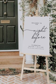 a welcome sign in front of a door with greenery on the outside and welcome to the night before