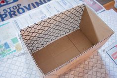 an open cardboard box sitting on top of a table