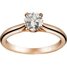 a rose gold engagement ring with a round diamond