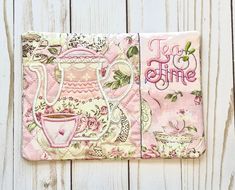 two pieces of fabric with tea time designs on them