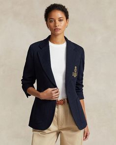 This modern blazer stands out with embellishing details while maintaining timeless style. Featuring a notched lapel, button front closure and long sleeves with buttoned cuffs, it offers versatile layering. An embroidered crest at the chest pocket along with hip and chest patch pockets add fashion-forward flair. Lined in luxurious fabrics, this piece moves effortlessly from day to night. Crafted from a soft blend, it feels as polished as it looks. With its back vent and adaptability for all occas Luxury Button-up Blazer With Pockets, Luxury Blazer With Patch Pockets For Work, Luxury Long Sleeve Blazer With Pockets, Ralph Lauren Long Sleeve Blazer, Ralph Lauren Lapel Collar Blazer For Fall, Ralph Lauren Fall Blazer With Lapel Collar, Ralph Lauren Blazer With Lapel Collar For Fall, Ralph Lauren Tailored Blazer For Workwear, Ralph Lauren Luxury Long Sleeve Blazer