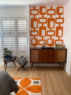 an orange and white wall in a bedroom