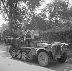 6th Airborne soldiers aboard a captured German half-track mounting a 20mm gun, which they used to shoot down a German aircraft, 28 August 1944 Old Singapore, The Seine, British Soldier, Army Vehicles, Fighter Planes