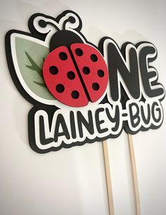 there is a sign with a ladybug on it that says one laine - bug