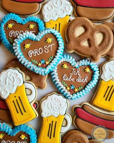 decorated cookies arranged in the shape of beer mugs and heart shaped pretzels