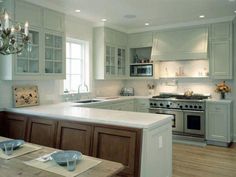 a kitchen with an island, stove and sink in it's centerpieces