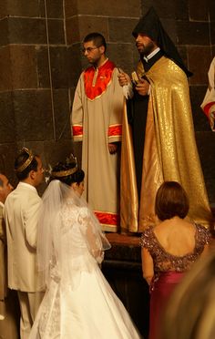 the bride and groom are getting ready to walk down the aisle at their wedding ceremony