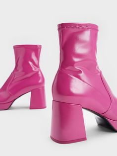 Bold and feminine, these fuchsia patent boots will definitely turn heads. The sleek high-cut ankle boots will have a leg-lengthening effect on all your fall ensembles, while the vibrant pink finish makes a striking statement. Balancing out the Barbiecore aesthetic are the strong angular lines - trapeze block heels complement the squared-toed silhouette. Stitch-trim detailings and a glossy finish add further textural interest while still looking polished and chic. The side-zips on this distinctive pair make them a breeze to put on and take off. Barbiecore Aesthetic, Patent Boots, Red Boots, Block Heel Boots, Charles Keith, High Cut, Put On, Heeled Boots, Block Heels