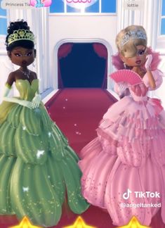 two barbie dolls standing next to each other in front of a red carpeted hallway