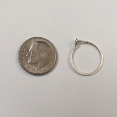 These sterling silver hoop earrings are hammered to shape. This simple elegant earring can be worn dressed up or dressed down. They are available in three different sizes: 13 mm diameter, 15 mm, and 17 mm. The earrings will be shipped in a decorative cardboard jewelry box filled with an anti tarnish cotton. Sterling silver is a metal that can tarnish, storing it in the box in which it is shipped will help prevent tarnishing. The piece can be cleaned with a polishing cloth or silver cleaner. Ster Small Hammered Hoop Earrings, Minimalist Hammered Sterling Silver Hoop Earrings, Hammered Open Circle Hoop Earrings For Gift, Hammered Open Circle Hoop Earrings As A Gift, Hammered Teardrop Sterling Silver Hoop Earrings, Hammered Sterling Silver Teardrop Hoop Earrings, Nickel-free Minimalist Hoop Earrings For Anniversary, Gift Hammered Open Circle Hoop Earrings, Minimalist Teardrop Hoop Earrings For Anniversary