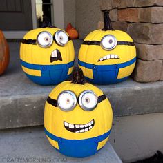 three yellow and blue pumpkins with pittsburgh steele's on them sitting on the steps