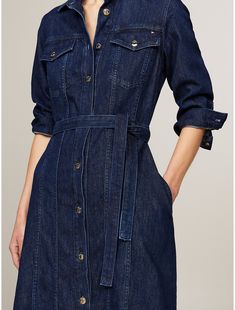 Tommy Hilfiger women's dress. Create casual style effortlessly with this midi-length denim dress, designed with a matching belt to cinch the waist.  Material: 86% Better Cotton Initiative, 14% Recycled Cotton. Casual Fitted Belted Dress For Spring, Chic Belted Knee-length Denim Dress, Chic Belted Denim Dress For Work, Chic Knee-length Belted Denim Dress, Denim Knee-length Shirt Dress For Work, Belted Knee-length Denim Dress, Casual Fitted Midi Belted Dress, Casual Fitted Midi Length Belted Dress, Knee-length Belted Denim Dress For Work