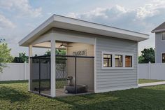 a small house with a dog kennel in the yard