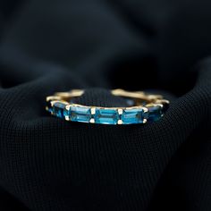 Product Details Presenting the handpicked elegant jewelry as we know that you are special. This Eternity ring is embellished with 5 CT Octagon Cut London Blue Topaz in Shared Prong Setting. Gemstones are studded nicely on the entire Solid Gold crafted Ring. Product Information SKU SHP-RINGS092021024 Width 3 mm Height 3.2 mm Weight 2.09 gm (Approximate) LONDON BLUE TOPAZ INFORMATION No.of Stones 14 Pieces Total Weight 3.92 Carat (Approximate) Dimension(approx) Emerald Cut-3X5 mm-14 Pcs Color Blue You Are Special, 18k Yellow Gold Ring, Blue Topaz Ring, London Blue Topaz, London Blue, Elegant Jewelry, Yellow Gold Rings, Eternity Ring, Prong Setting