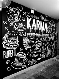 a black and white photo of a wall with writing on it that says karma