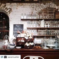 an old fashioned kitchen with lots of glassware