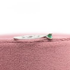 This dainty ring features a 0.24 round Emerald solitaire set in solid 14K gold. This Emerald ring makes a lovely May birthstone gift for your loved ones! This ring is made with solid 14K Gold and natural Earth mined SI / G-H diamonds. As listed, this ring is ready to ship. If you're interested in purchasing this setting with a different center stone please message us! Emerald Solitaire Ring, Designer Silver Jewellery, Jewelry Showcases, May Birthstone, Birthstone Gifts, Natural Earth, Earring Findings, Dainty Ring, Pendant Bracelet