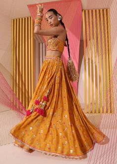 This stunning lehenga in rich look, embellishment and elongated butti detail come together in a flowing lehenga. The feminine blouse uses exquisite zardosi detail to enhance the neck, give this a younger feel. Floral Print Lehenga, Gopi Vaid, Sheer Dupatta, Orange Lehenga, Print Lehenga, Halter Neck Blouses, Scallop Border, Embroidered Motifs, Orange Floral Print