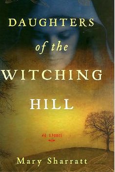 the cover of daughters of the witching hill by mary sharrat, with an image of a woman's face