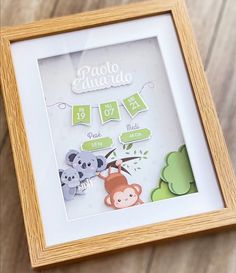 a photo frame with some cut out animals in it