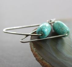 "These elegant and minimalist earrings made with hand forged 18 gauge sterling silver wire accented with beautiful barrel shape turquoise stone (11mm by 7mm in size) and were tumbled, oxidized and hand polished for antique finish patina. The earrings are approximately 1\" (2.5cm) long in total. ATTENTION - ORDERS TO US: Shipping to US uses USPS First Class shipping option. Delivery standard time 2-3 business days with USPS Tracking number. USPS Priority Shipping can be selected on checkout for a Minimalist Turquoise Wire Wrapped Earrings, Minimalist Turquoise Earrings For Everyday Wear, Minimalist Turquoise Earrings For Everyday, Scarf Pin, Earrings Geometric, Earrings Simple, Earrings Minimalist, Threader Earrings, Metal Pins