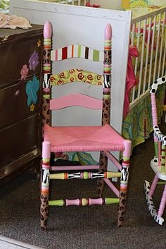 a child's rocking chair and crib in a room