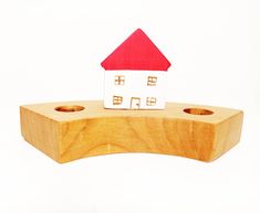 a wooden block with a house on it