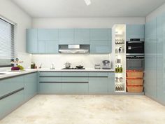 a kitchen with light blue cabinets and white counter tops is seen in this image from the side