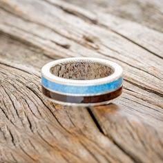 a close up of a ring on a wooden surface