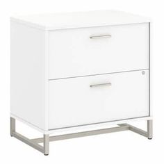 a white cabinet with two drawers on one side and metal legs at the other end