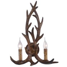 the antler chandelier has three candles in it