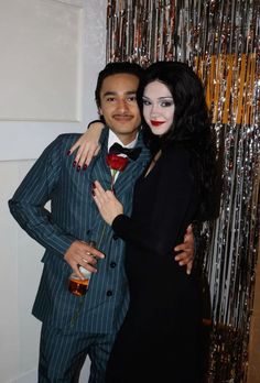 a man and woman dressed up for halloween