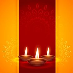 three lit candles sitting on top of a red and yellow background with swirly designs