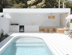 an outdoor hot tub in the middle of a deck