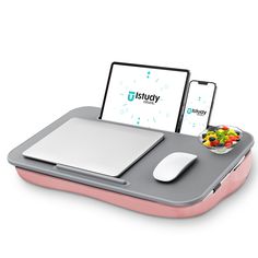 a laptop and mouse on a tray with food