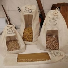 three bags filled with food sitting on top of a counter