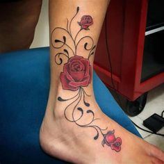 a woman's foot with a rose tattoo design on the bottom and lower leg