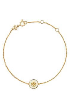 A polished Tory Burch logo set in a lacquered charm brings signature sophistication to a delicate chain bracelet. 6 3/4" length; 1 1/2" extender 18k-gold plate/acrylic/moonstone Imported Classic Adjustable Jewelry With Logo Charm, Signature Logo Design, Tory Burch Kira, Floral Pendant, Logo Set, Square Pendant, Delicate Chain, Crystal Stud Earrings, Womens Jewelry Bracelets