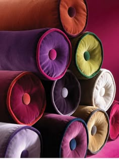 colorful pillows stacked on top of each other in the shape of an o - ring